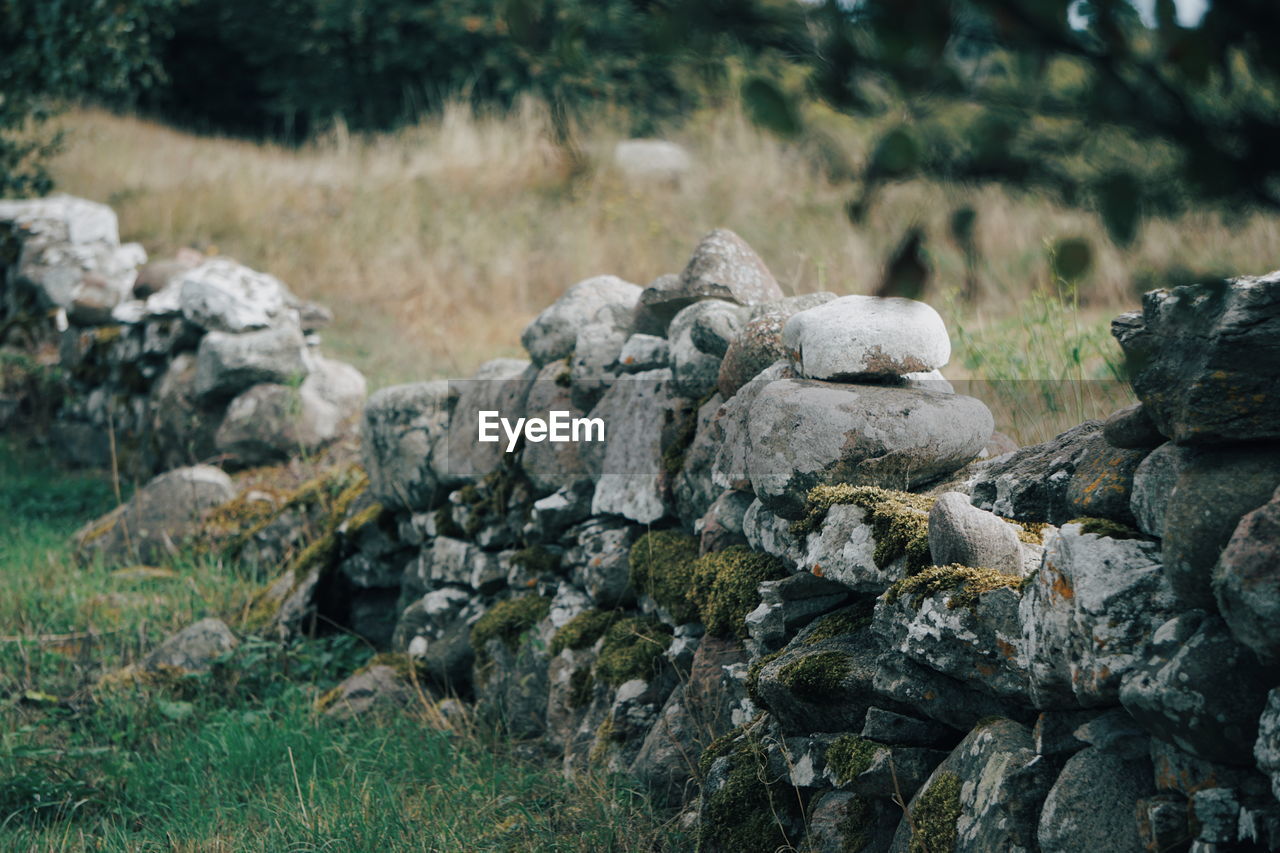 Stone wall on field