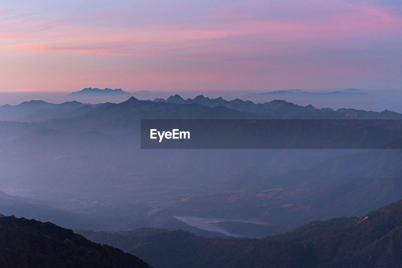 Scenic view of mountains against sky during sunset