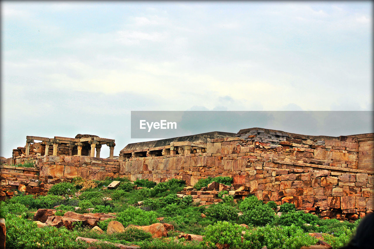 OLD RUINS AGAINST CLOUDY SKY