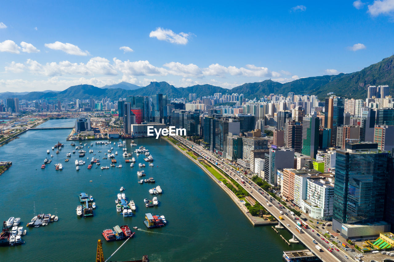 High angle view of harbor and buildings in city