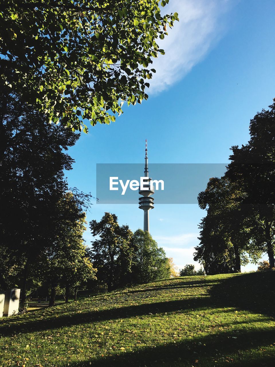 Low angle view of communications tower against sky