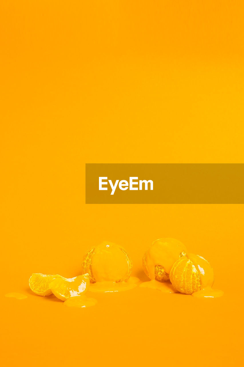 Orange with cream against colored background