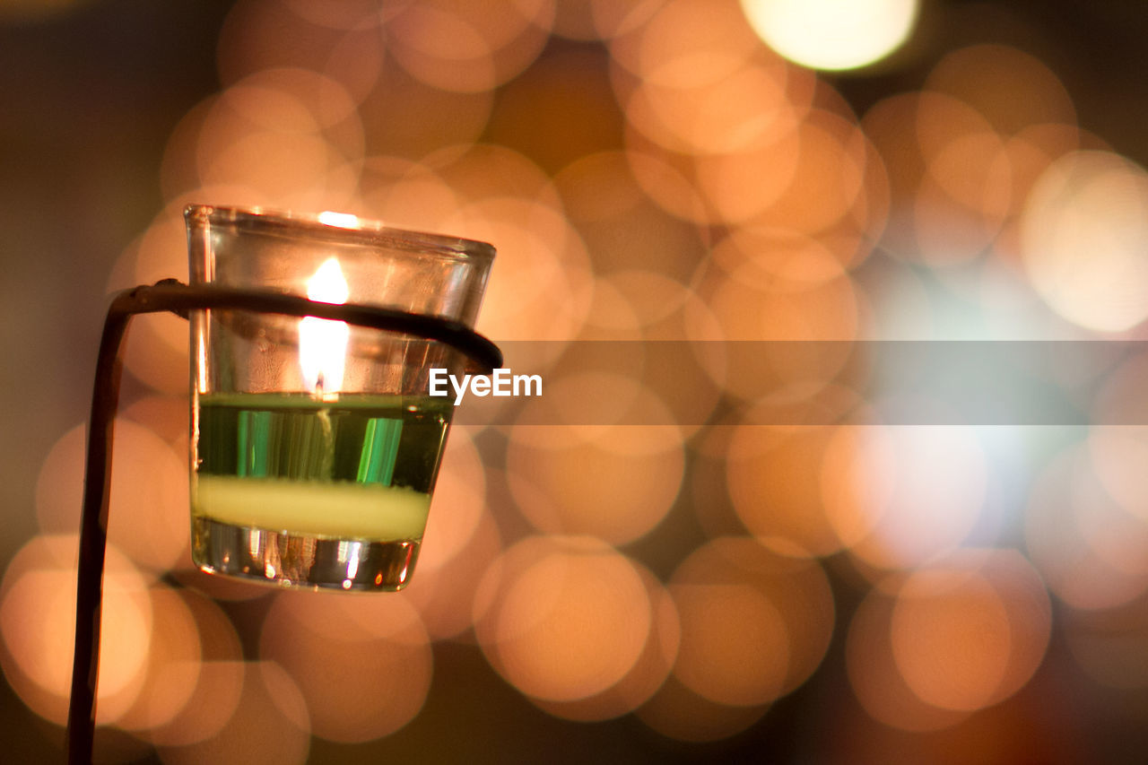 Close-up of illuminated tea light