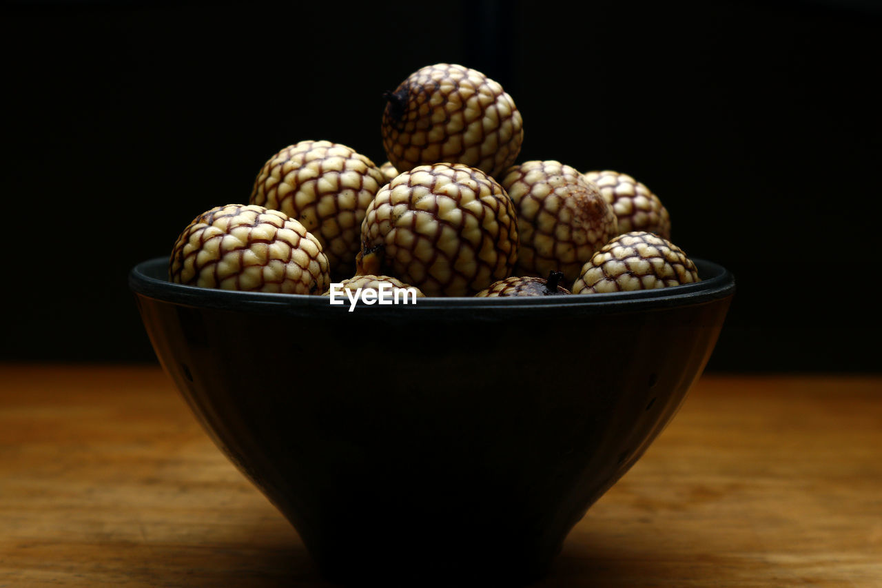 Close-up of fruits in bowl on table