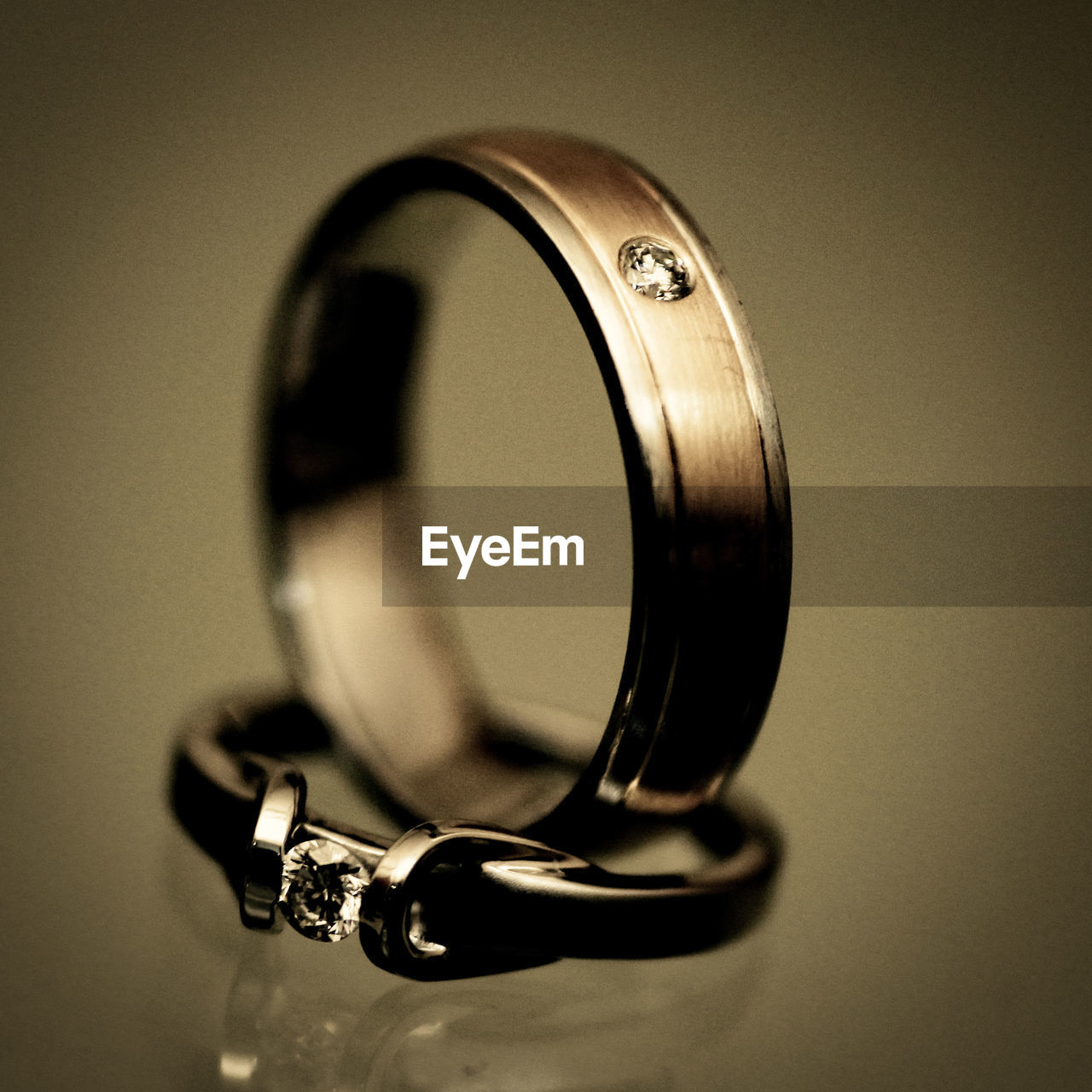 ring, jewellery, indoors, close-up, wedding ring, fashion accessory, black, metal, no people, single object, circle