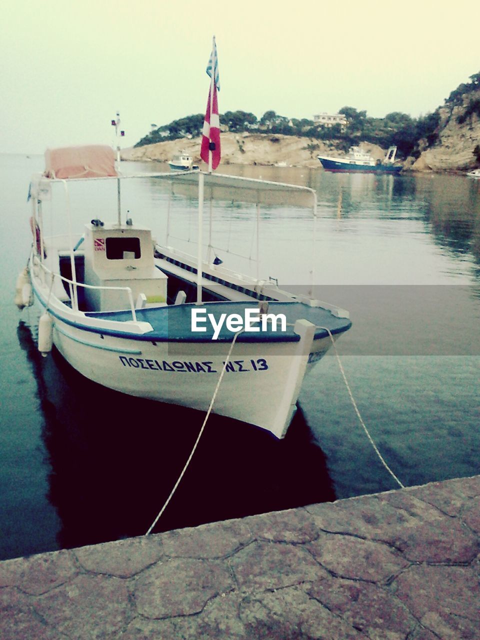 Boat moored in lake