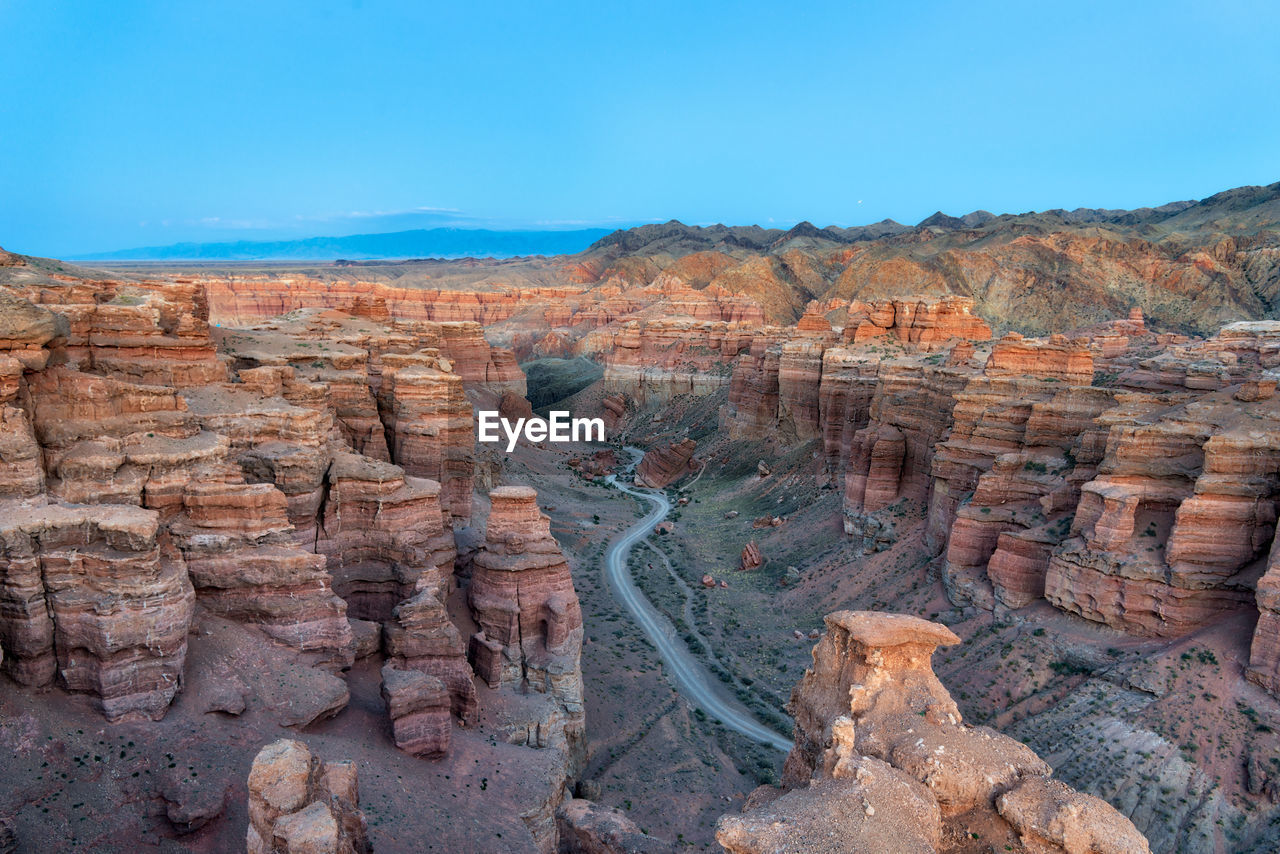 Scenic view of rock formations against sky