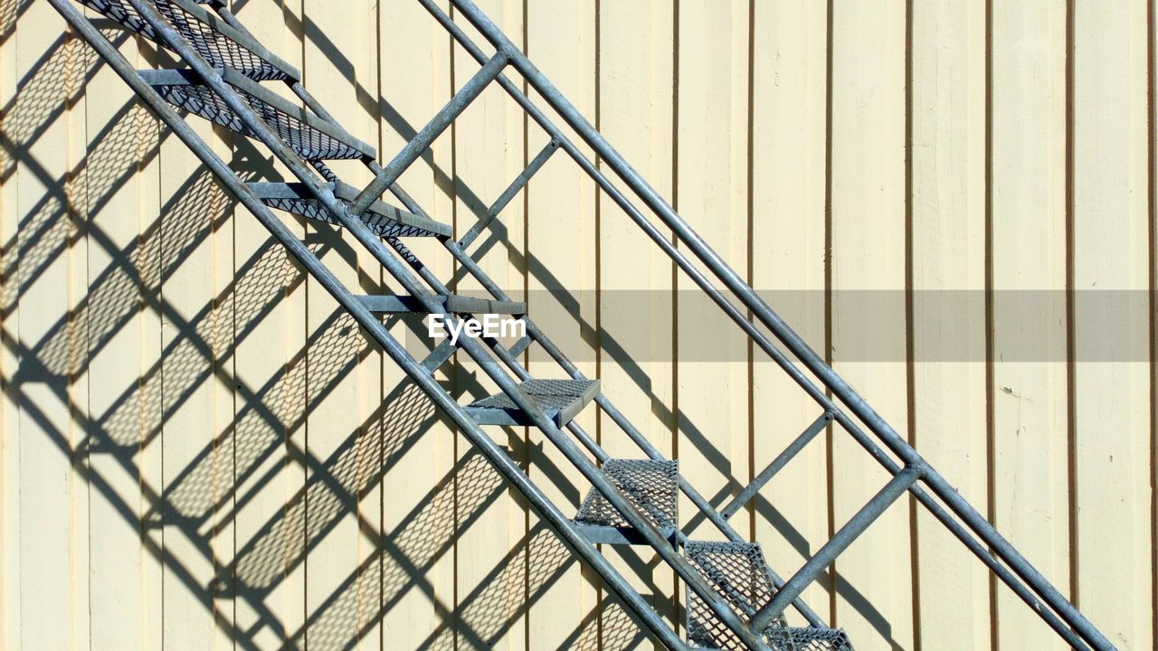 Low angle view of staircase on wall