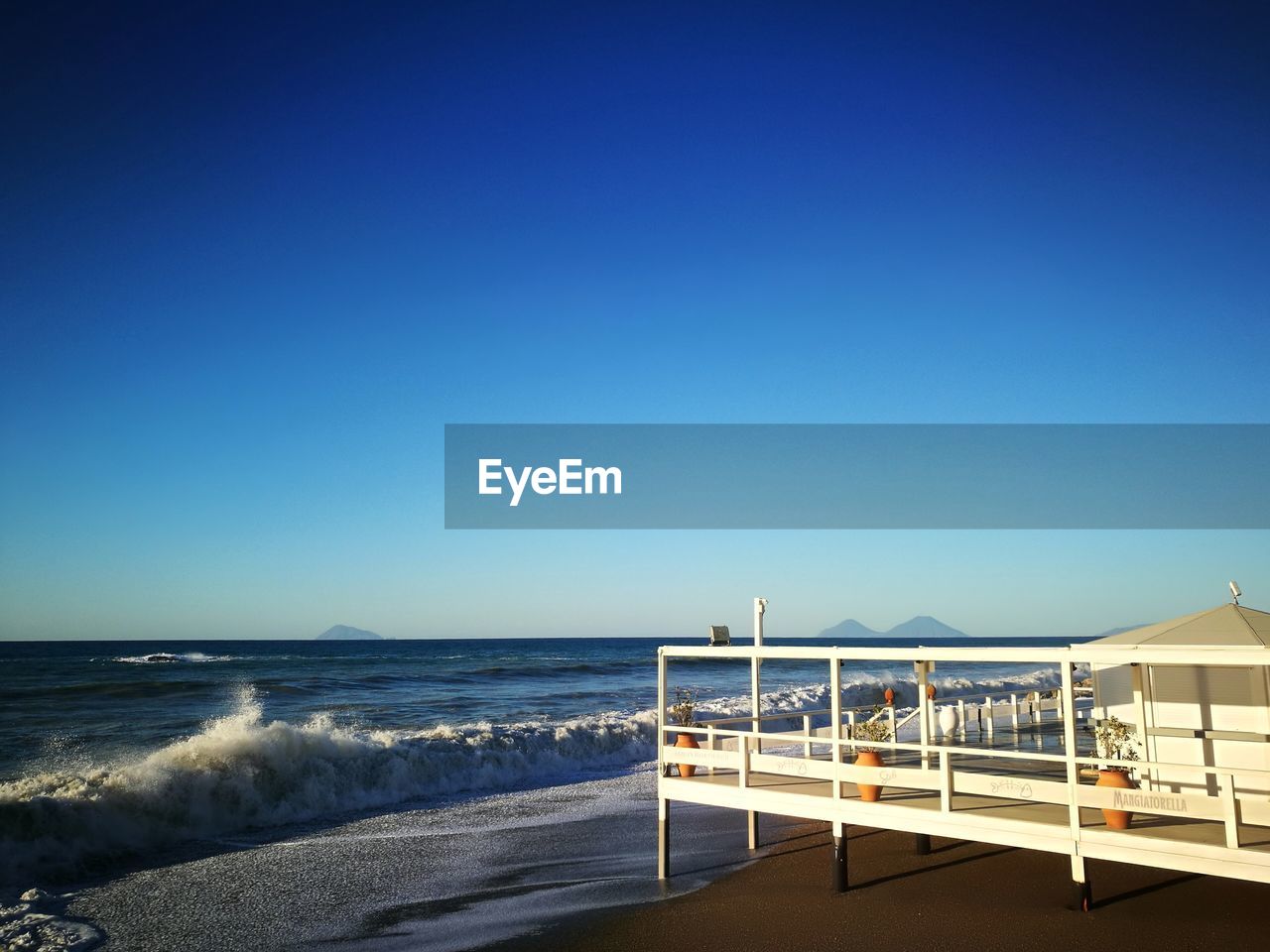 SCENIC VIEW OF BEACH AGAINST CLEAR SKY