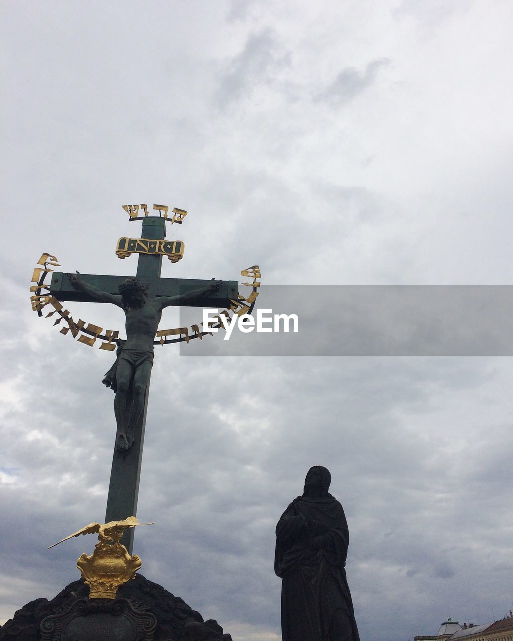 LOW ANGLE VIEW OF BUDDHA STATUE AGAINST SKY