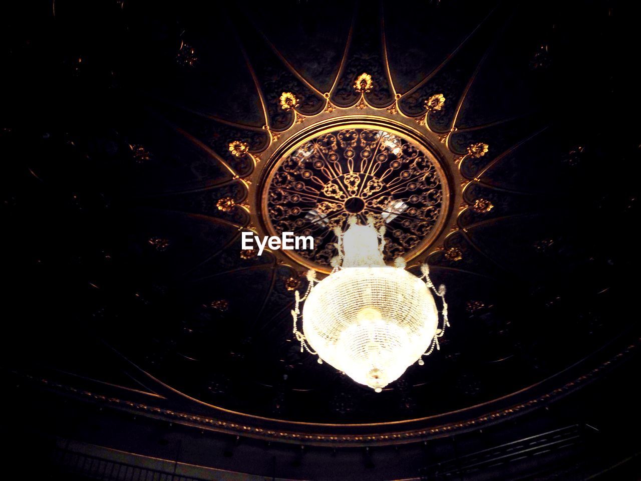 Low angle view of elegant chandelier hanging on ceiling at trinity theatre