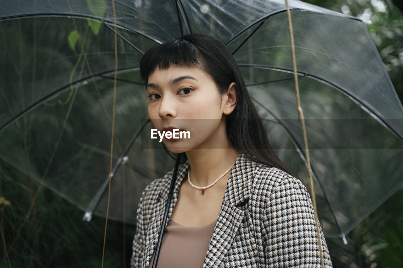 Portrait of young woman looking away