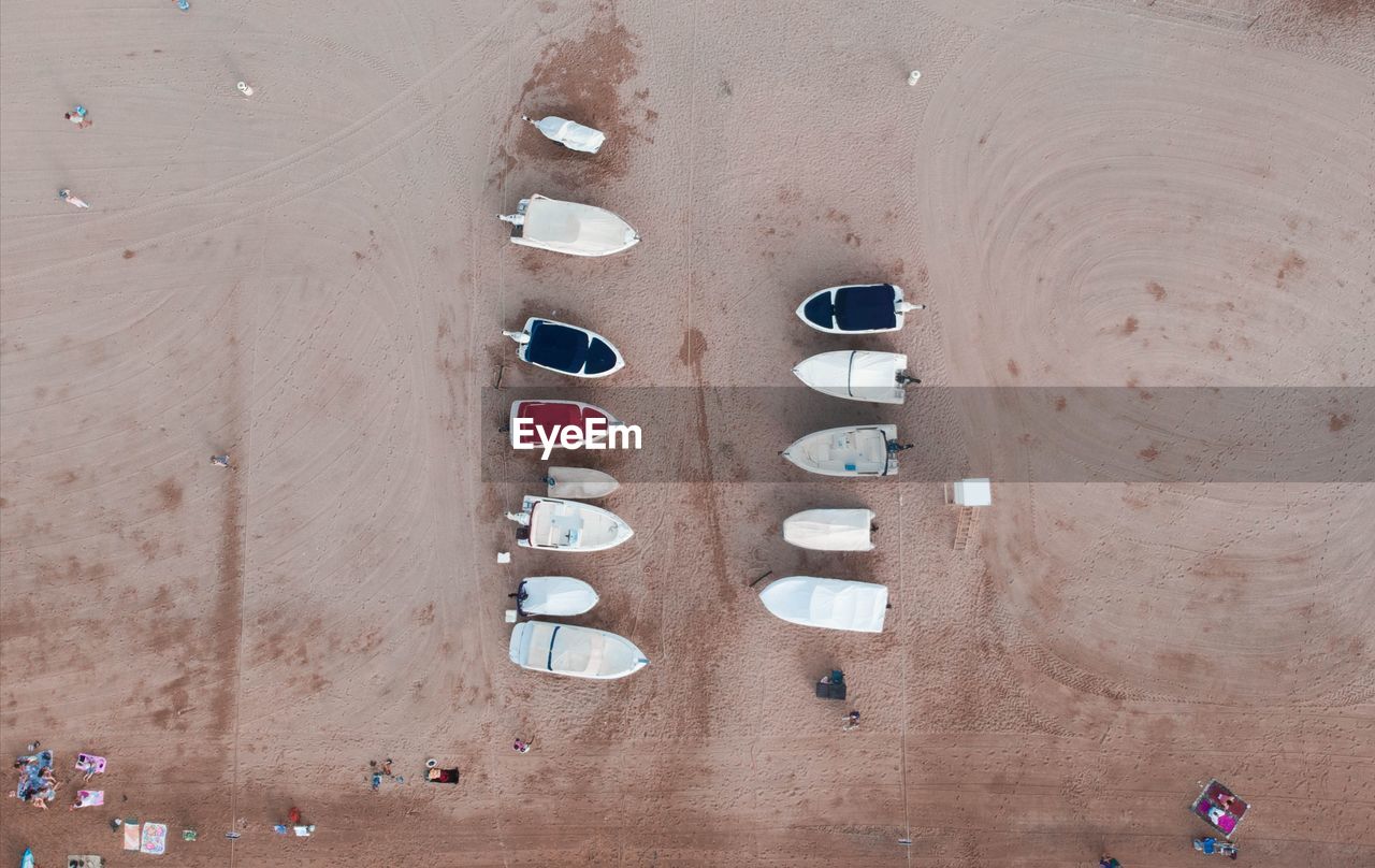 High angle view of moored boats on sand at beach