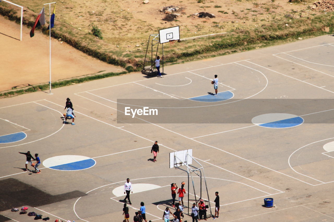 High angle view of people playing at basketball court