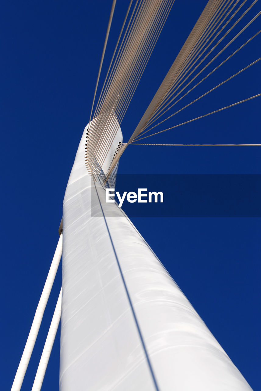 LOW ANGLE VIEW OF MAST AGAINST BLUE SKY