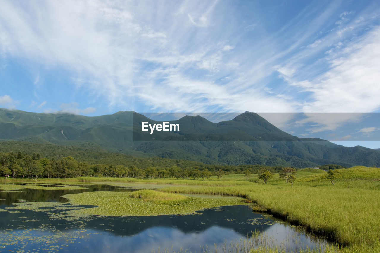 Scenic view of shiretoko goko lakes and mountains against sky in hokkaido, japan