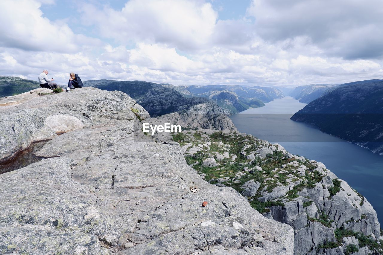 PANORAMIC SHOT OF ROCKS ON MOUNTAIN AGAINST SKY