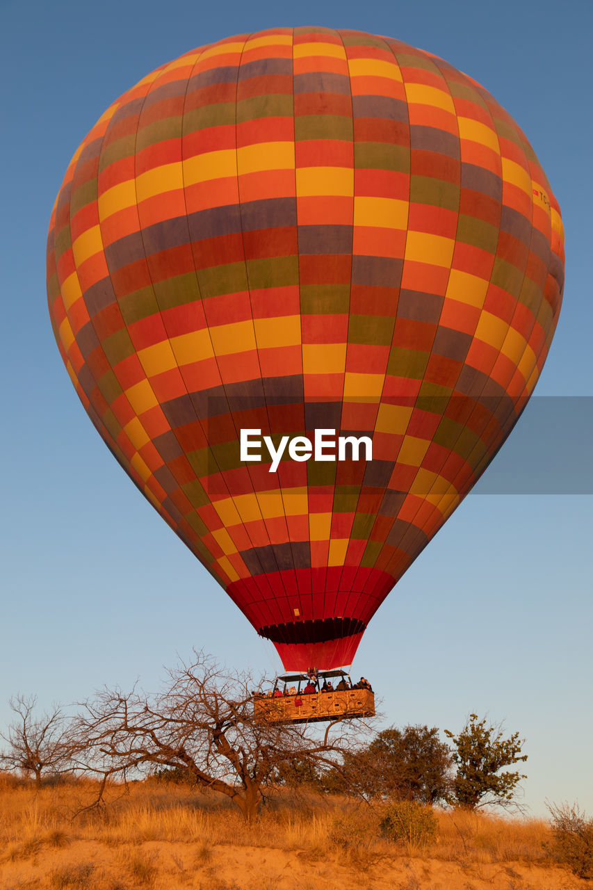 LOW ANGLE VIEW OF HOT AIR BALLOON AGAINST SKY