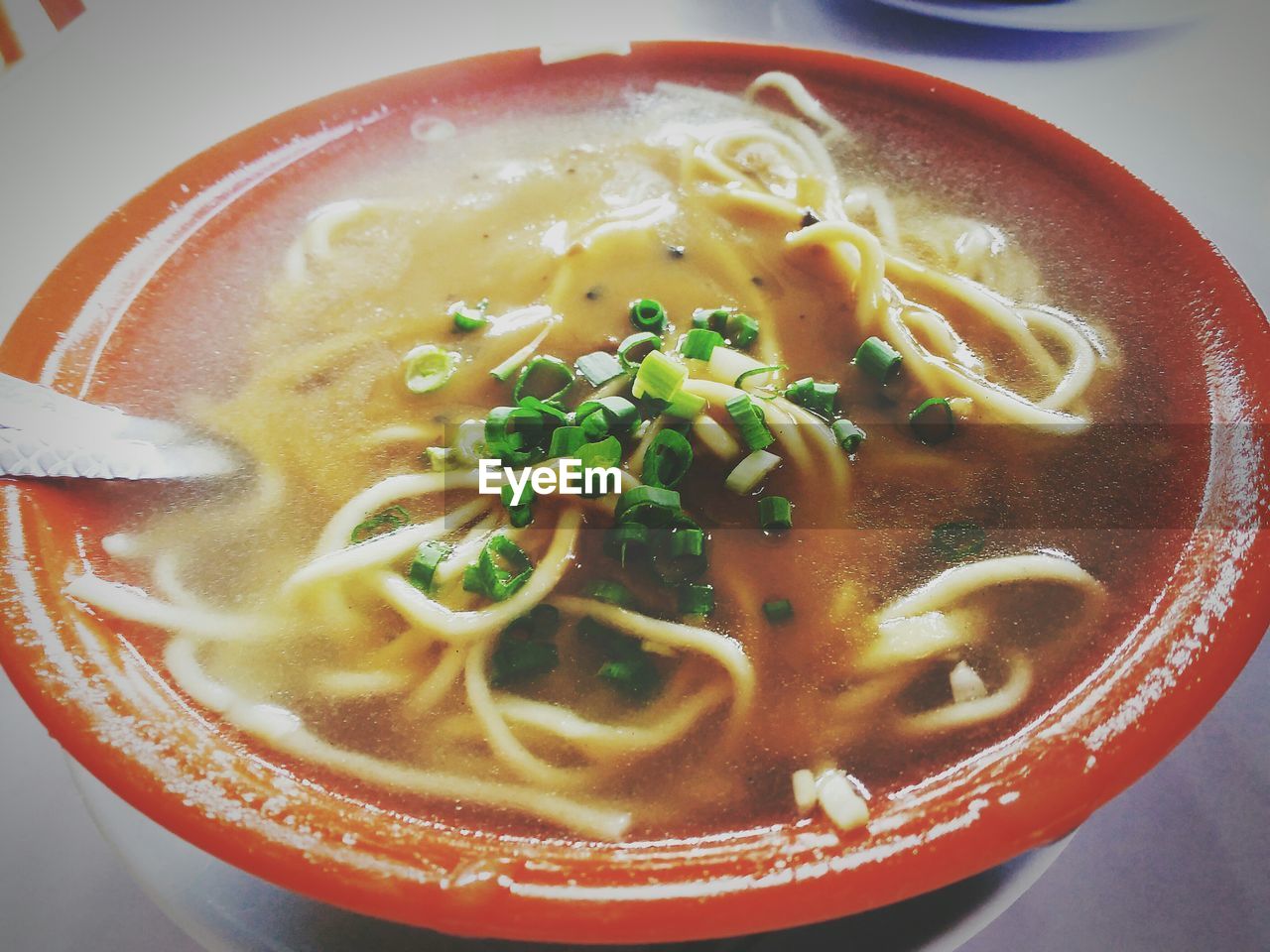 High angle view of noodle soup served in bowl on table