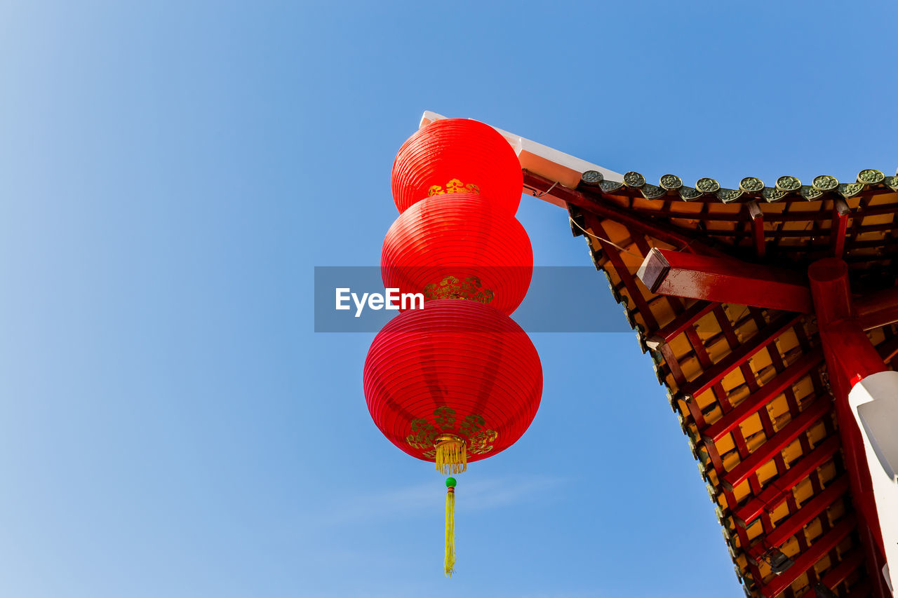 LOW ANGLE VIEW OF LANTERN AGAINST CLEAR BLUE SKY