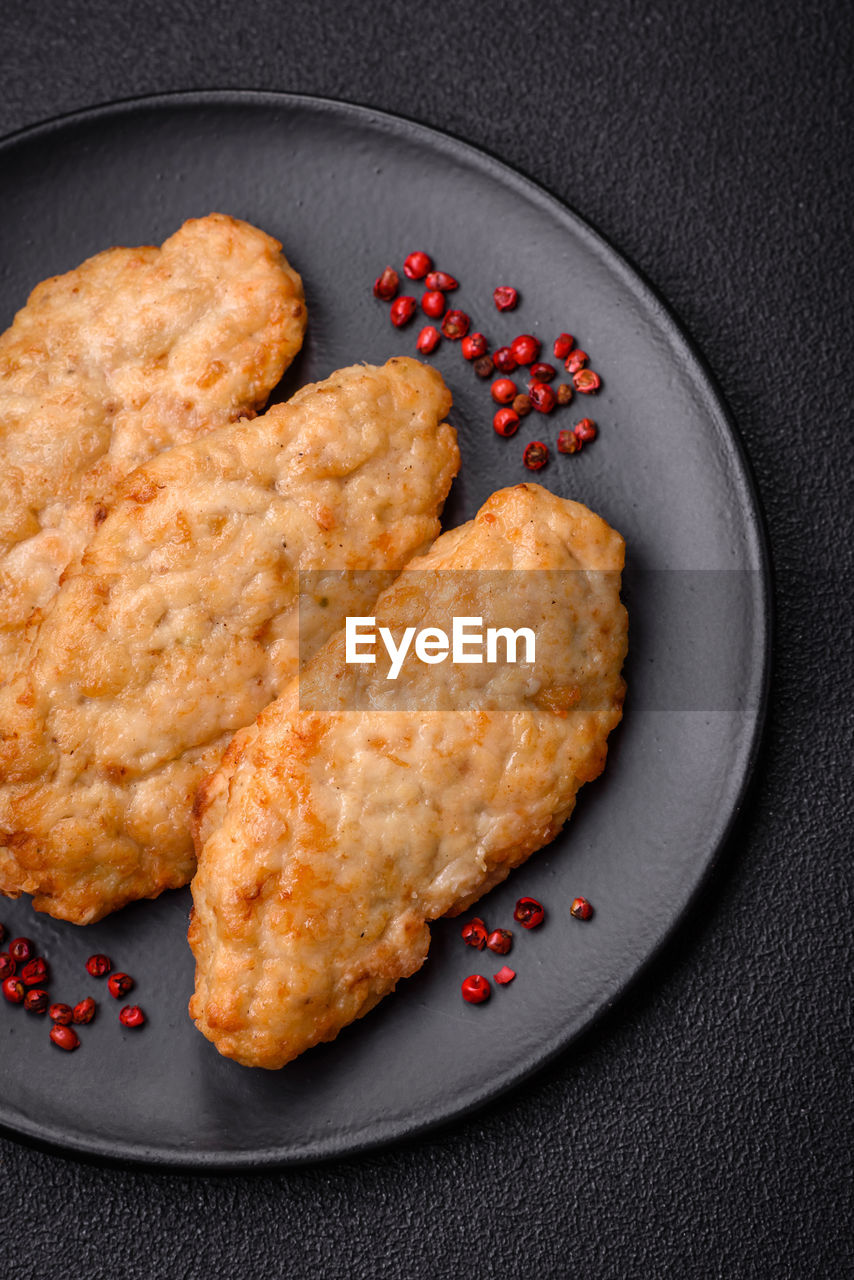 food and drink, food, dish, studio shot, produce, baked, fried food, no people, dessert, meal, cookie, breakfast, freshness, black background, indoors, snack, sweet food, fried, fruit, healthy eating, cookies and crackers, gray, plate, fast food