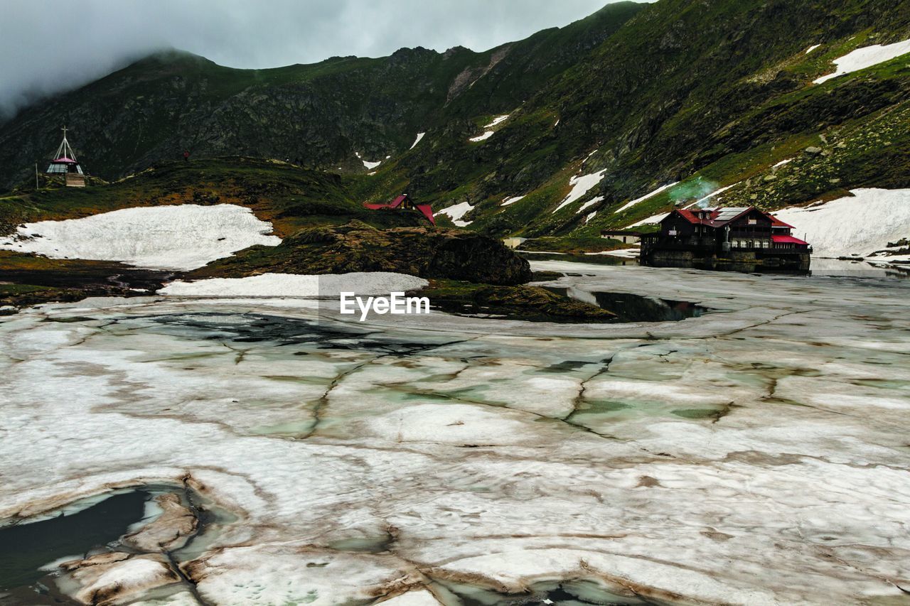 Mountain Beauty In Nature Scenics - Nature Water Rock Nature Tranquility Day Tranquil Scene Mountain Range Non-urban Scene Rock - Object No People Solid Environment Sky Cold Temperature Landscape Flowing Water Flowing Mountain Peak