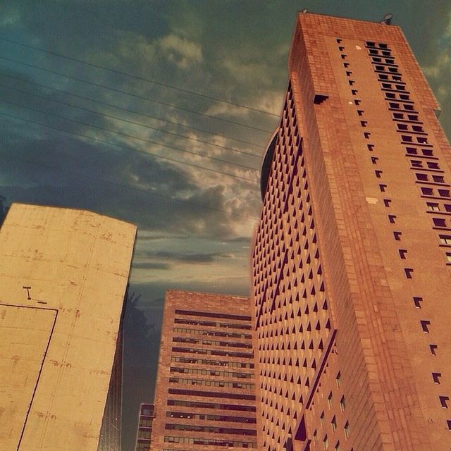 LOW ANGLE VIEW OF BUILDINGS AGAINST SKY