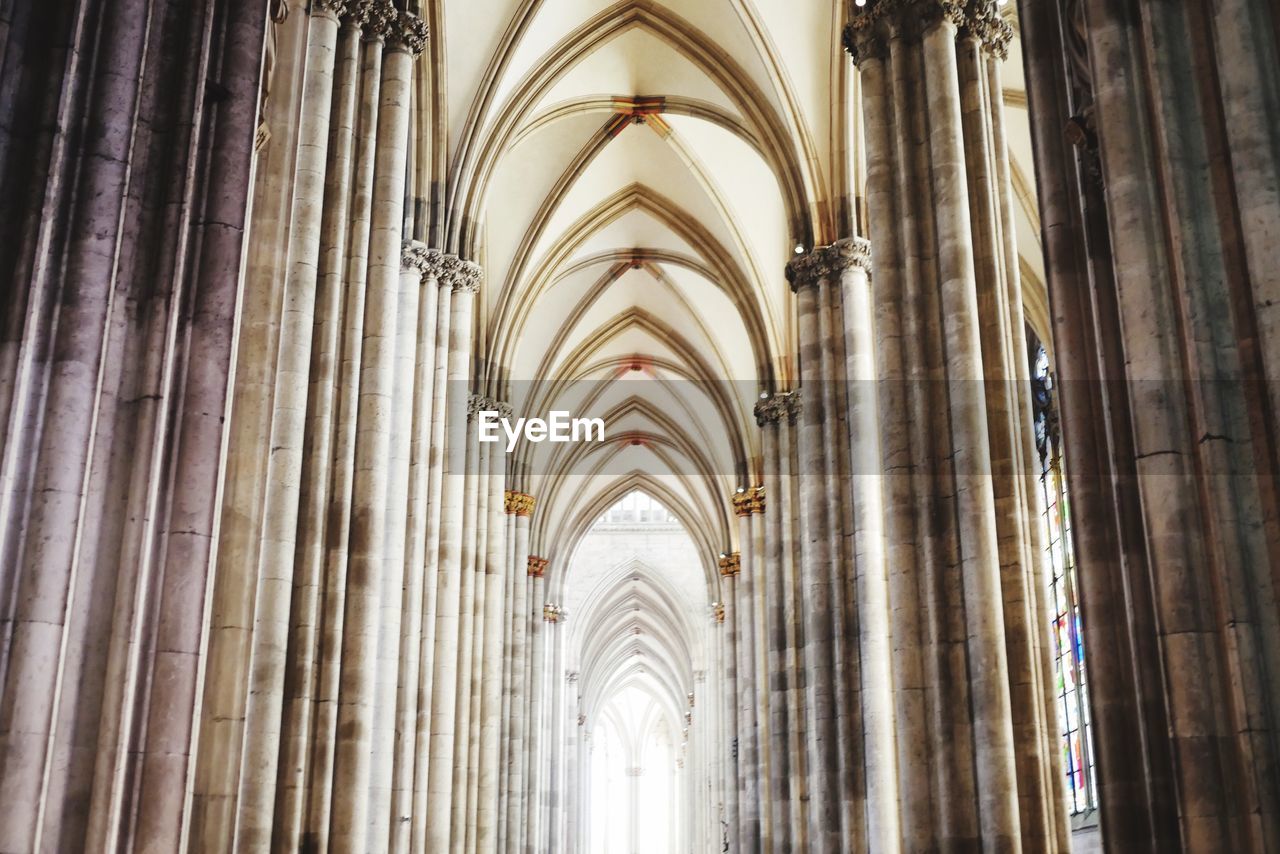 LOW ANGLE VIEW OF CROSS ON BUILDING