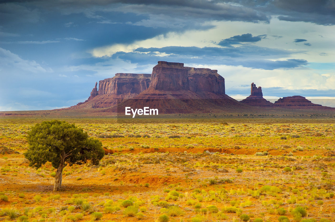 Rock formations on landscape monument valley against sky