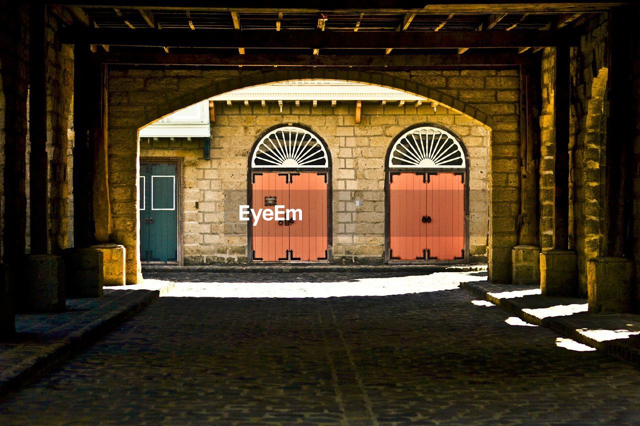 Building seen through arch bridge