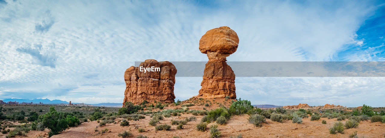 ROCK FORMATION ON LANDSCAPE AGAINST SKY