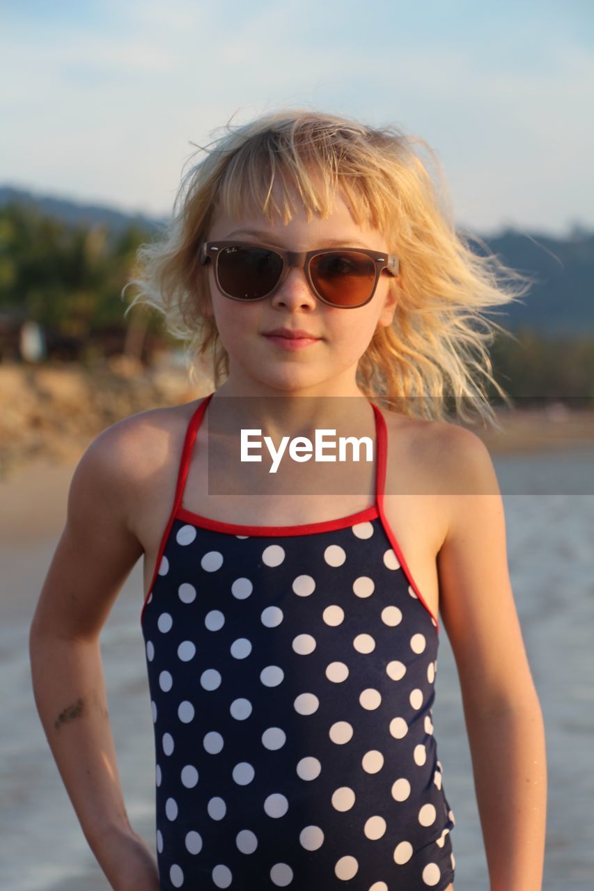 Portrait of young woman wearing sunglasses