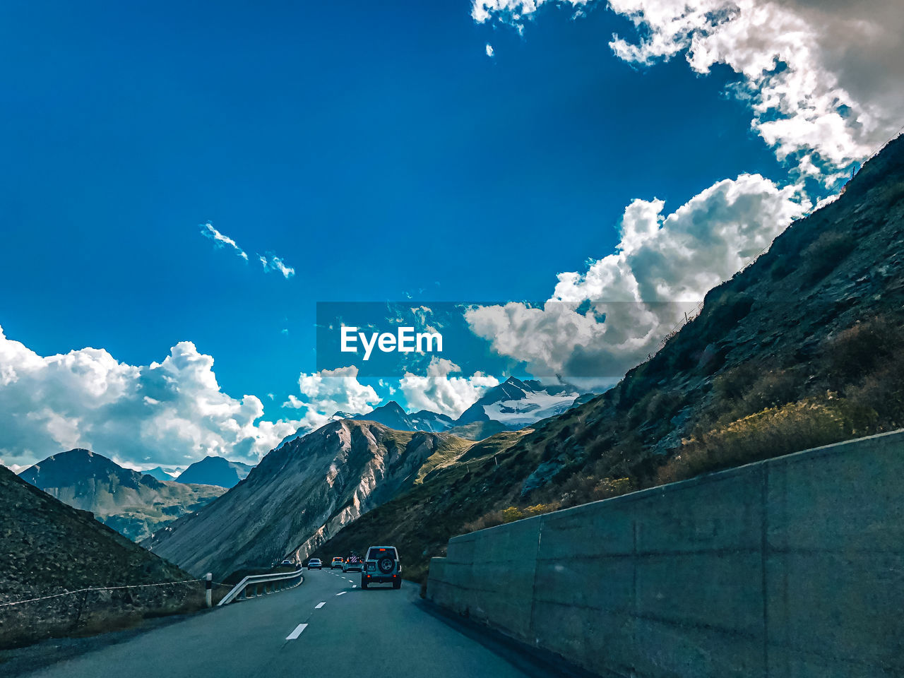 Road amidst mountains against sky