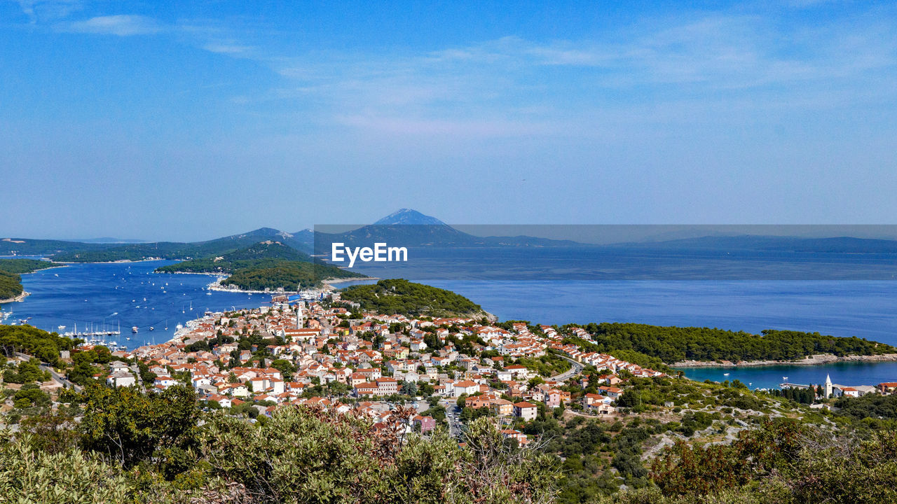 High angle view of townscape by sea