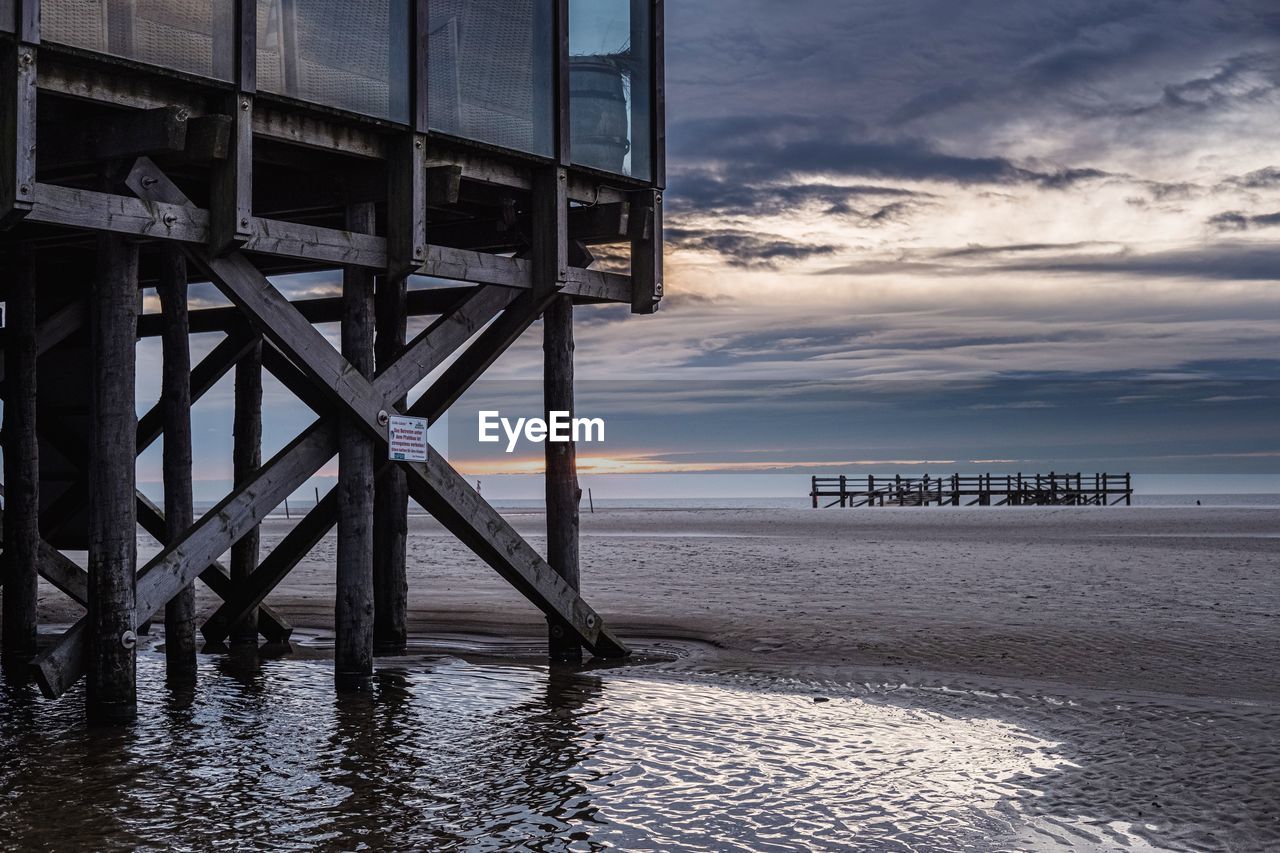 PIER OVER SEA AGAINST SKY