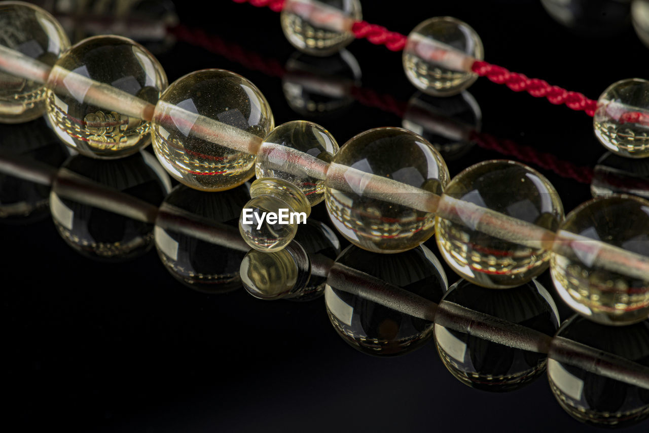 Close-up of bead necklace on table