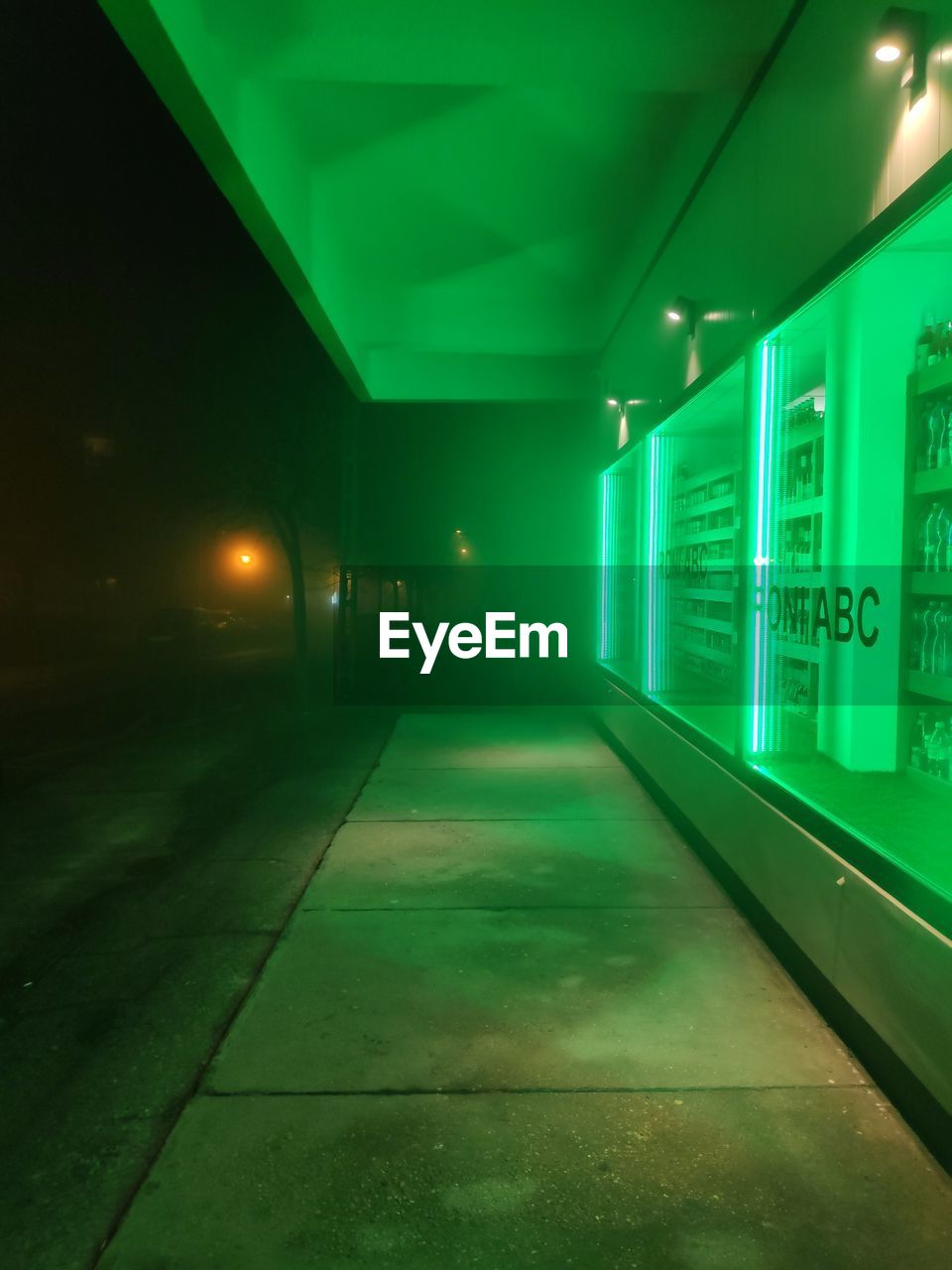 ILLUMINATED LIGHT TRAILS ON BUILDING