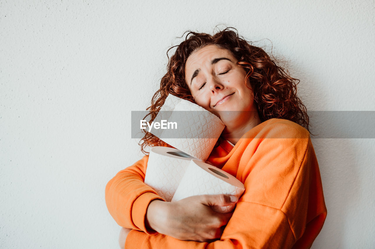 Woman holding tissue rolls