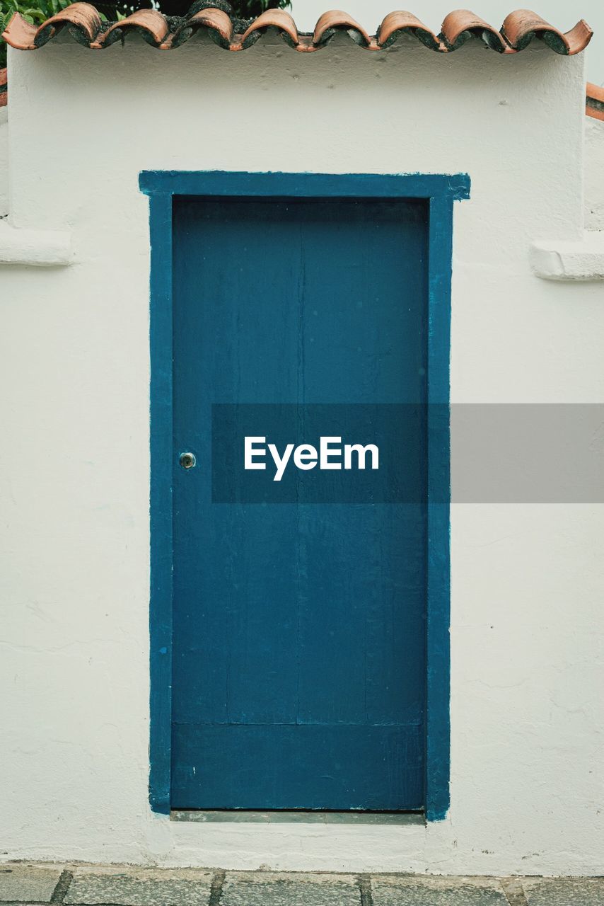 CLOSED BLUE WINDOW OF BUILDING