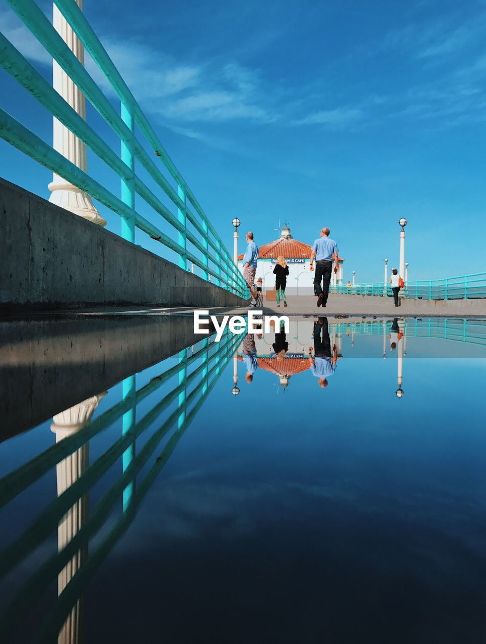 PEOPLE ON LAKE BY WATER