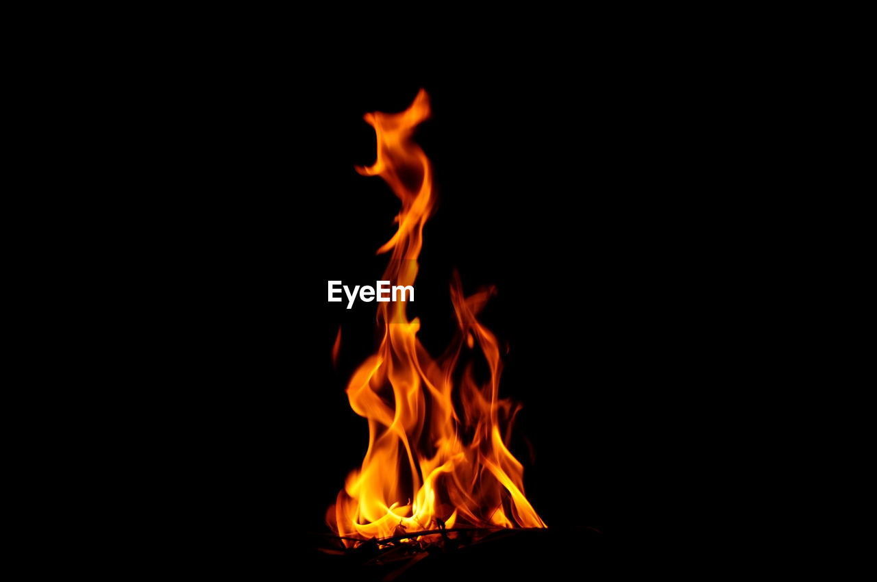 Close-up of fire against black background