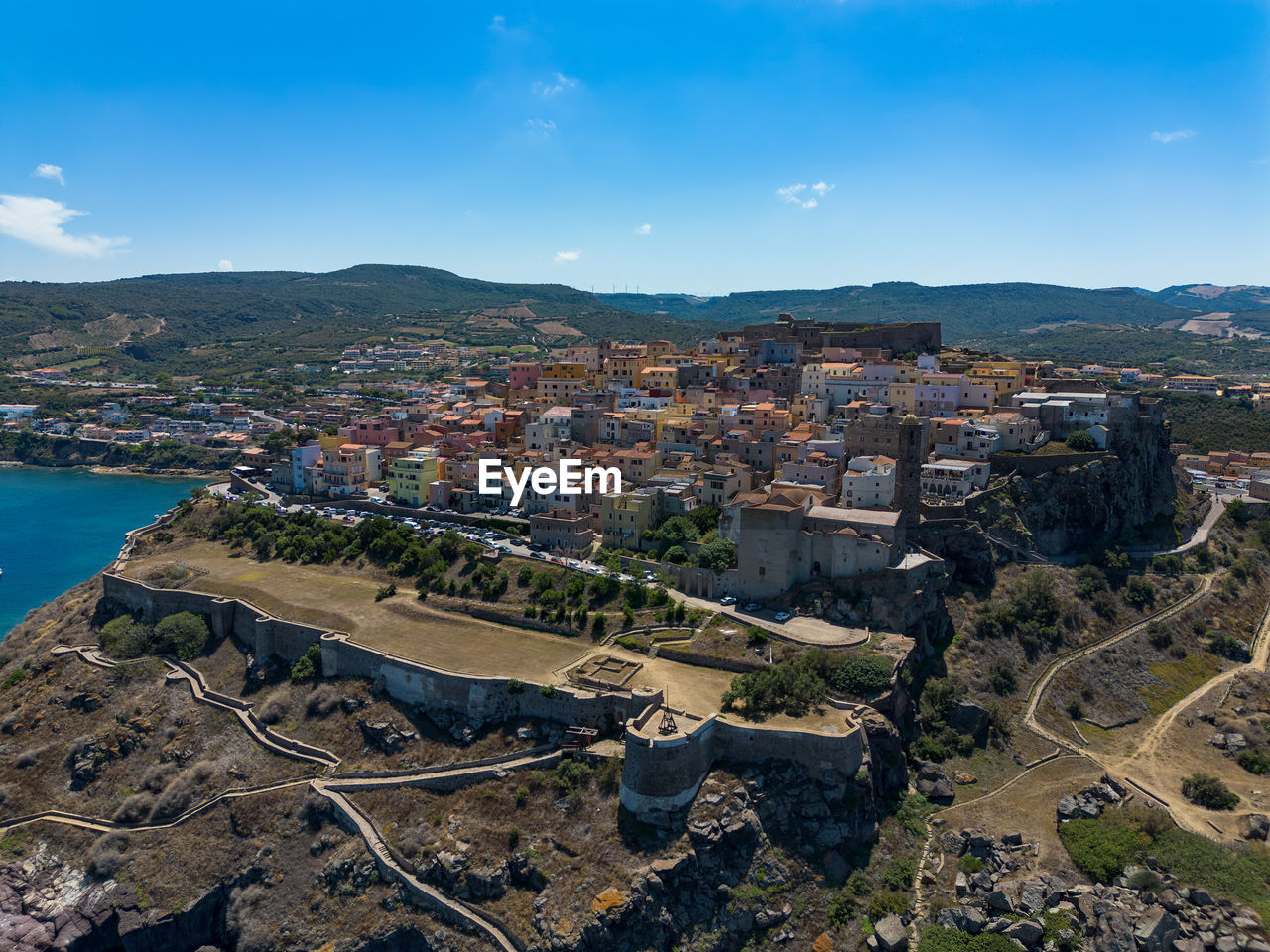 architecture, aerial photography, city, built structure, building exterior, building, cityscape, sky, town, nature, high angle view, water, landscape, travel destinations, environment, residential district, bird's-eye view, travel, aerial view, land, blue, coast, house, no people, outdoors, sea, mountain, tourism, transportation, scenics - nature, day, cloud, history, street, business finance and industry, the past, city life, landmark, road, construction industry, urban skyline