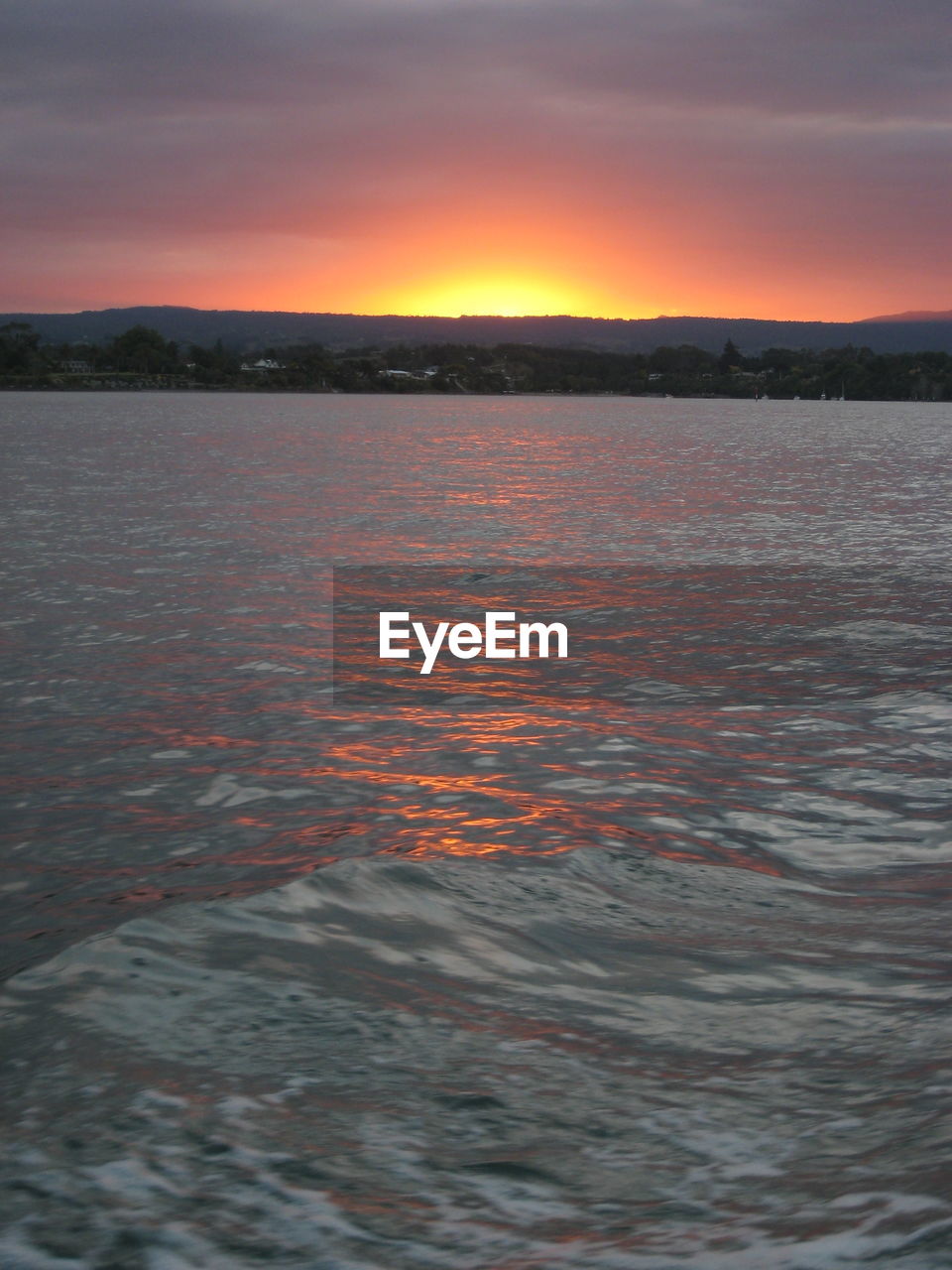 SCENIC VIEW OF SEA AGAINST ORANGE SKY