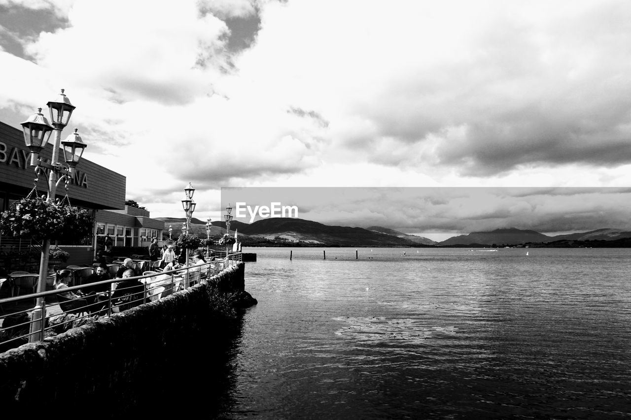 water, sky, cloud, black and white, monochrome, monochrome photography, architecture, nature, sea, built structure, transportation, ship, vehicle, nautical vessel, building exterior, no people, travel destinations, day, outdoors, travel, mountain, mode of transportation, scenics - nature, coast, beauty in nature, waterway