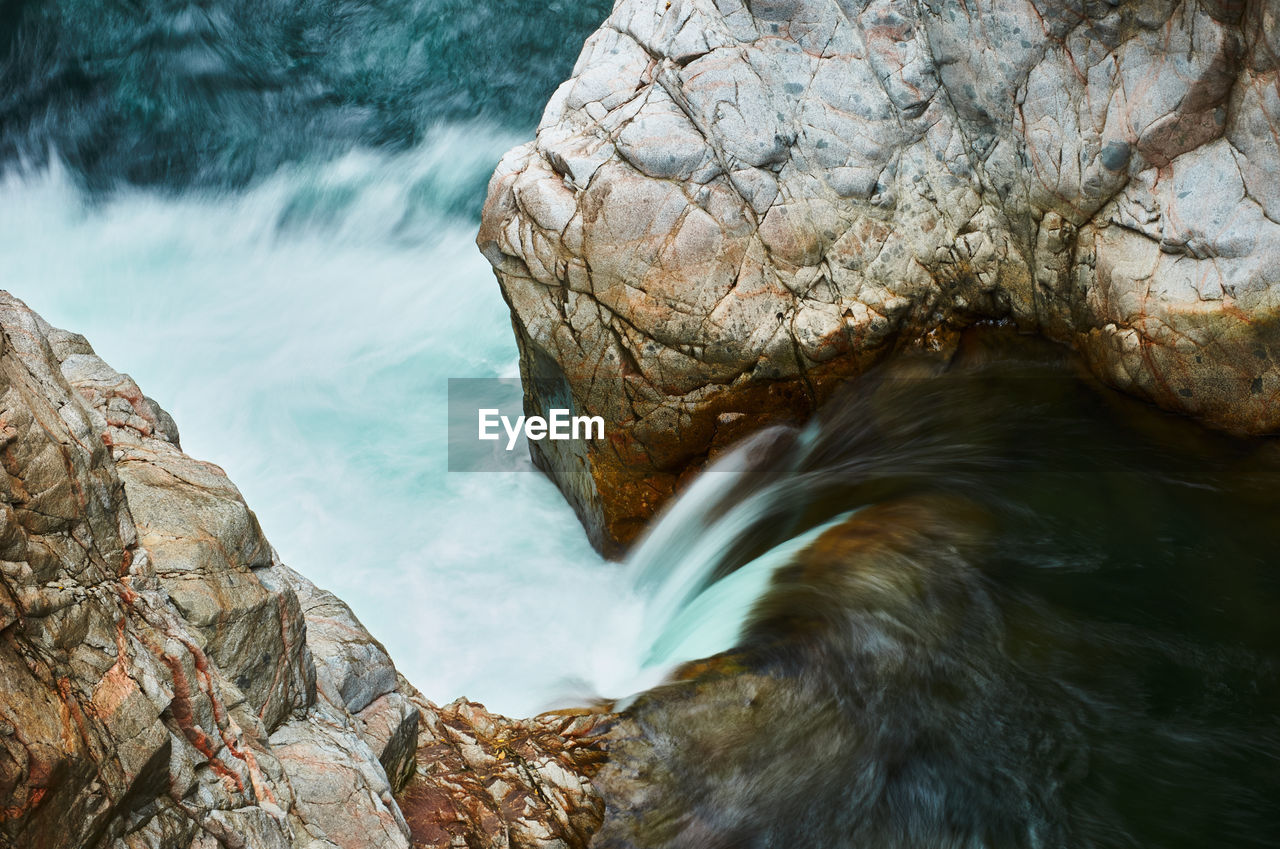 Close-up of rock formation against sea