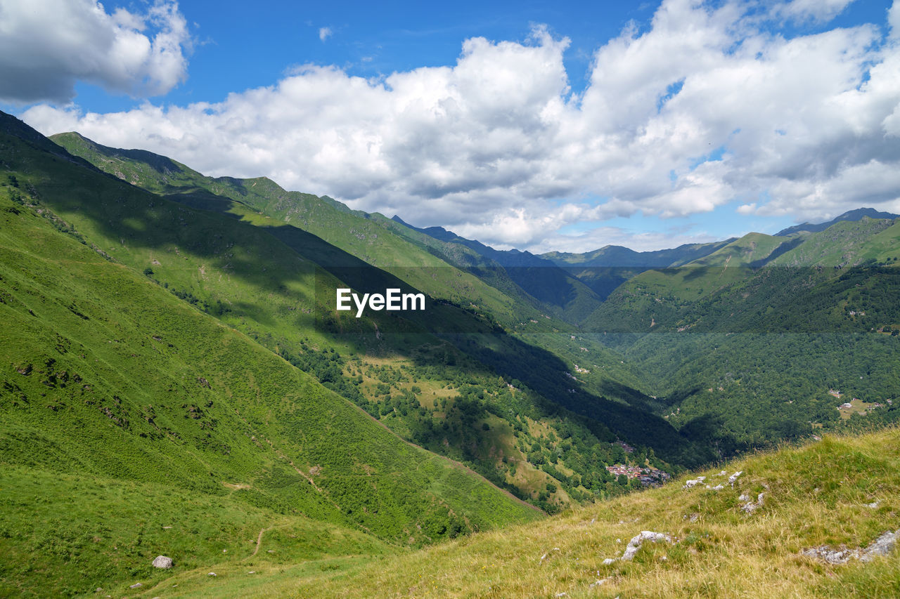 Lush green rolling mountain landscape above lake como / lago di como, italy.