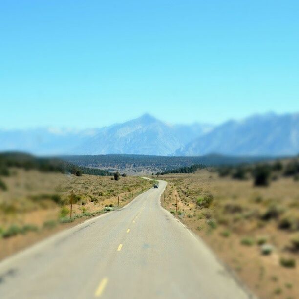ROAD LEADING TOWARDS MOUNTAINS