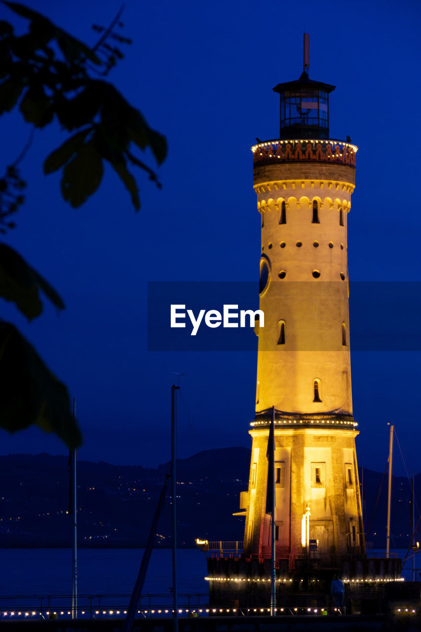 architecture, tower, night, building exterior, built structure, lighthouse, illuminated, building, travel destinations, nature, sky, guidance, water, blue, no people, travel, dusk, history, city, nautical vessel, the past, outdoors, sea, lighting equipment, transportation, tourism