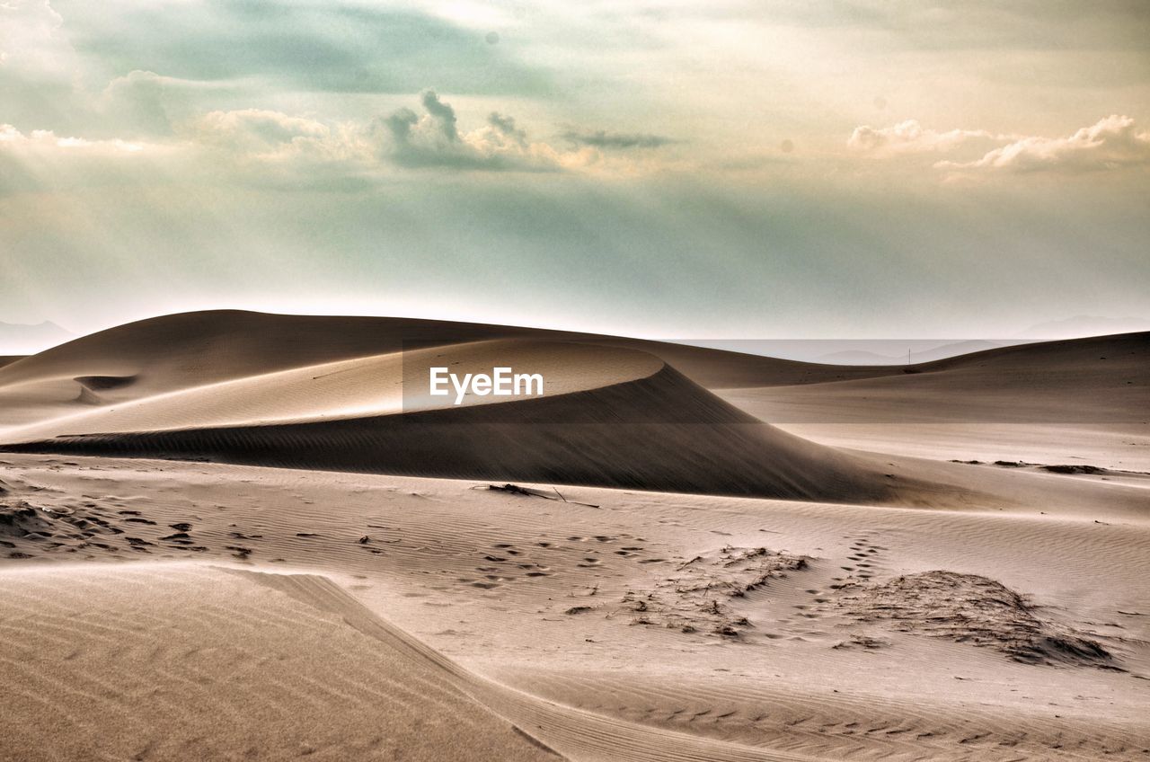 Scenic view of desert against sky