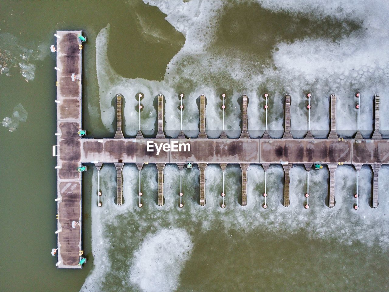 Aerial view of a wooden pier in winter